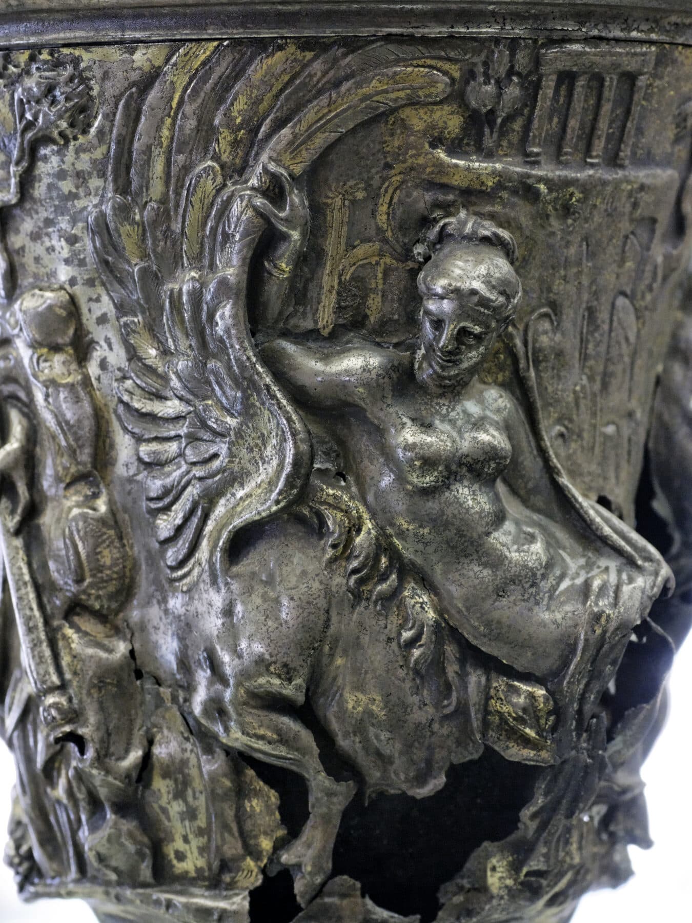 A Roman silver jug with a band of figures — a water nymph and Pegasus — standing out in raised relief worked in repoussé.